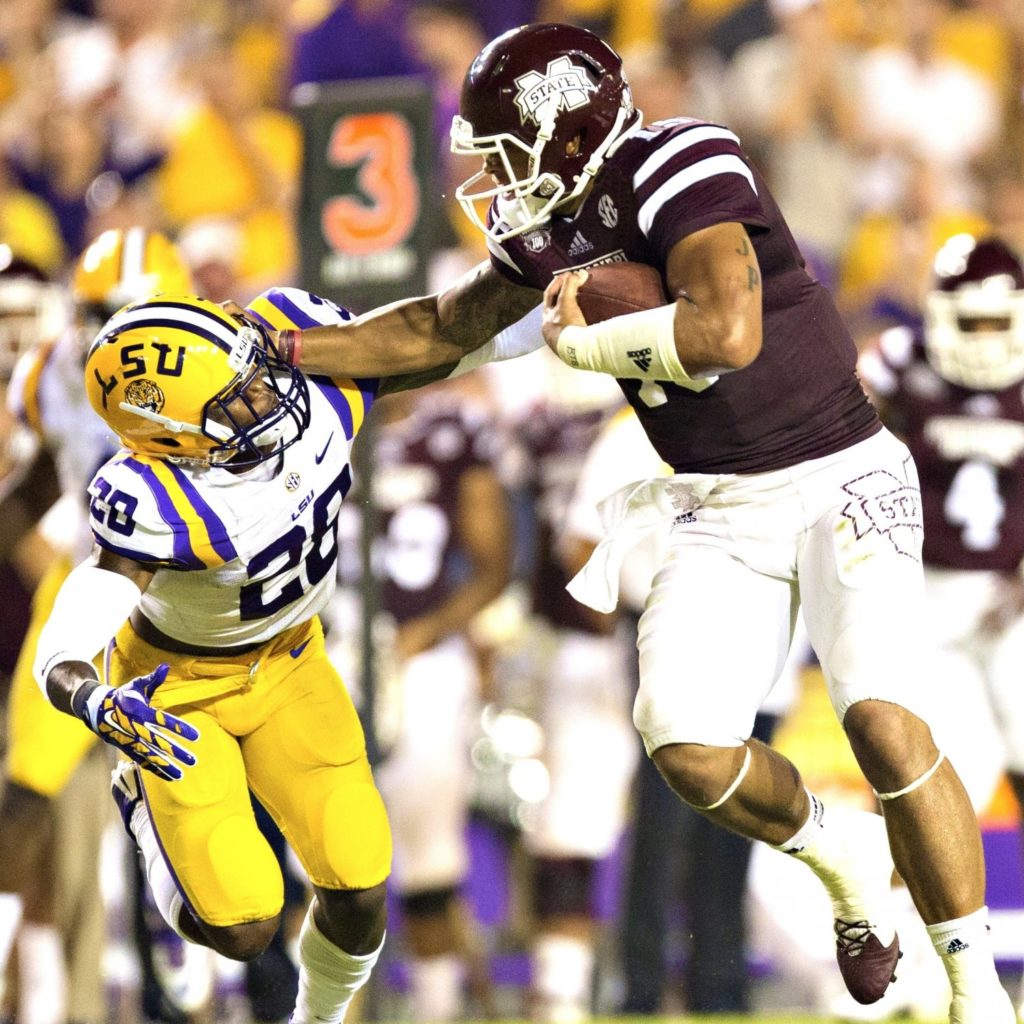 Dak Prescott ran with power, as seen in this run against the LSU Tigers at Baton Rouge.
