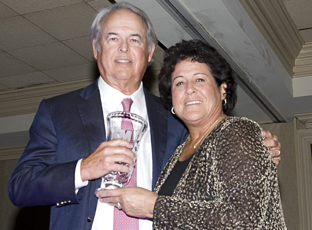 George Bryan receives MGA award from Golf Hall of Famer Nancy Lopez.