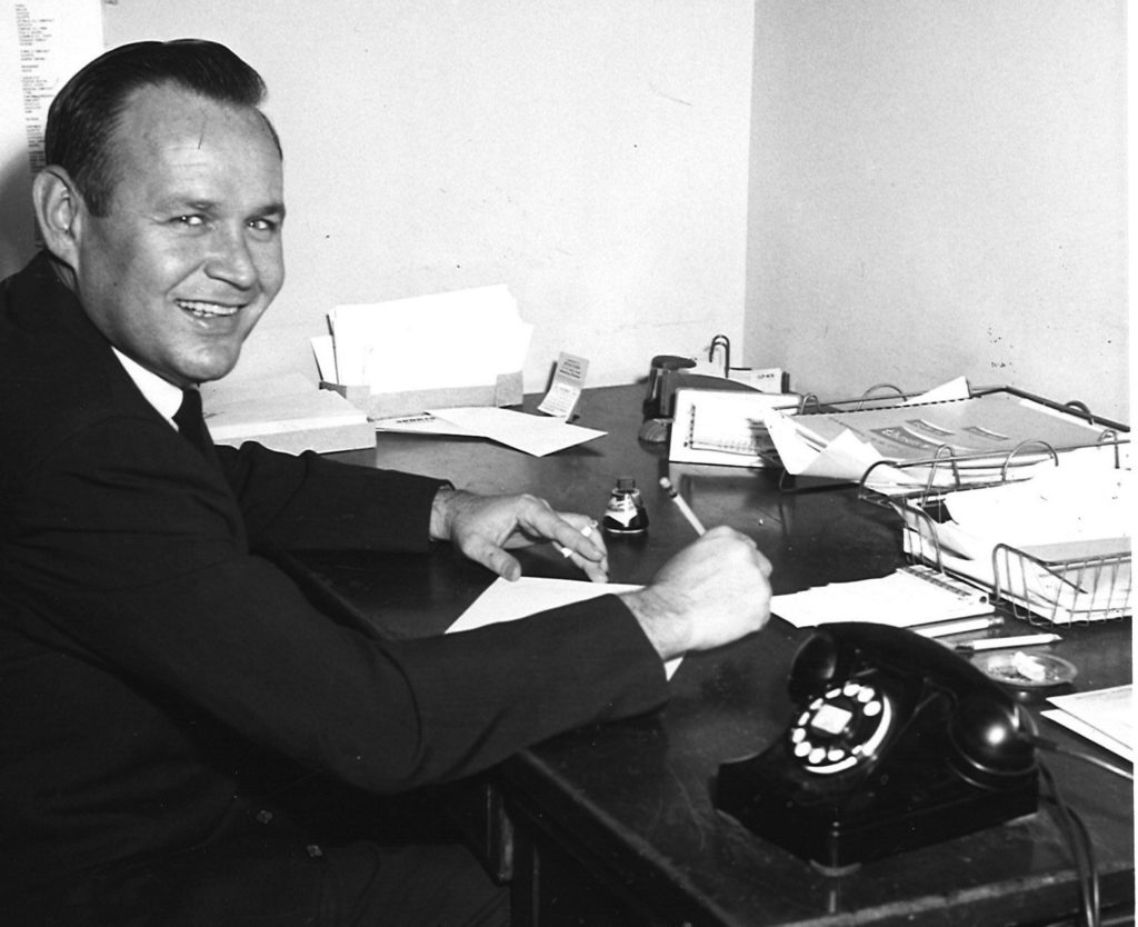 Ace Cleveland, at his desk, circa 1960.